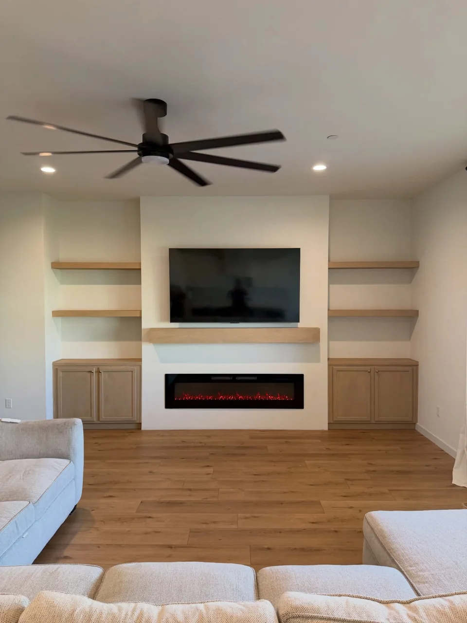 Oak-and-white custom entertainment wall.