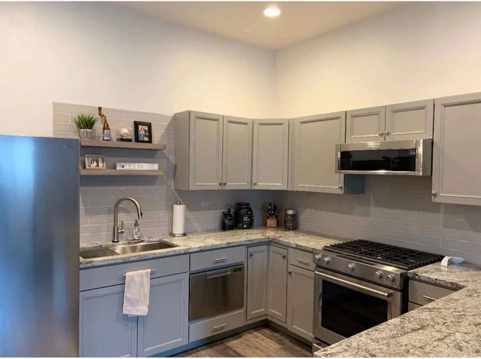 Gray cabinet and backsplash kitchen.