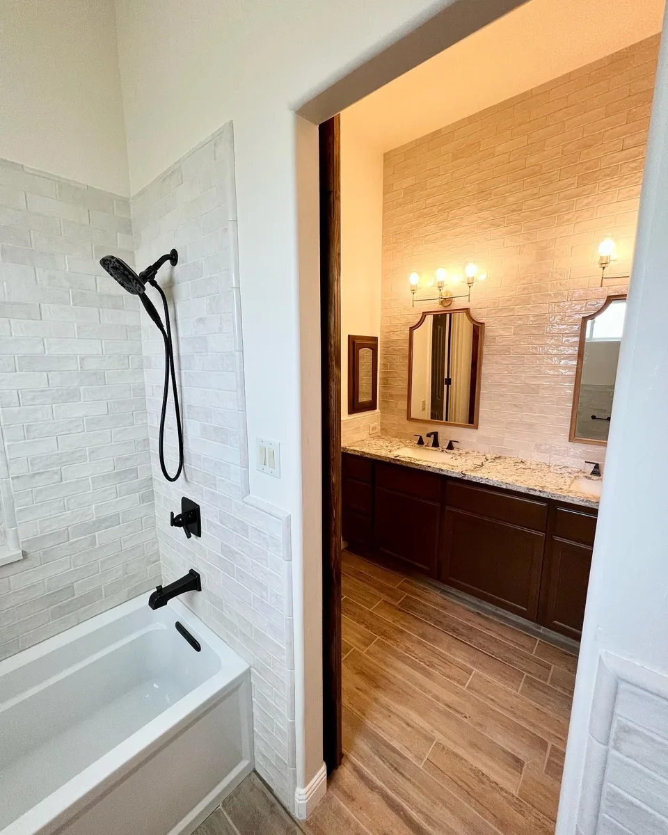Bathroom tub and double vanity suite.